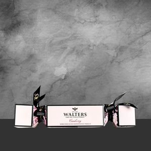 Walters Cranberry dark chocolate coated honey nougat in festive cracker packaging with black ribbon