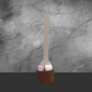 Chocolate spoon with pink and white marshmallows on wooden handle against gray textured background